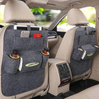 Car-back-seat-organizer setup on beige seats with multiple compartments for drinks, tablets, and tissues.
