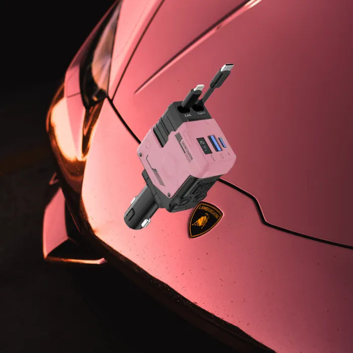 Pink car charger on shiny pink Lamborghini hood near emblem with dark background lighting.