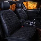Car Seat Heater black quilted pads on dark car interior with warm lighting.