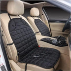 Car Seat Heater black padded cover on beige car seats with 12V plug attached.