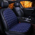 Car Seat Heater blue quilted cushion on single front car seat with dark interior.