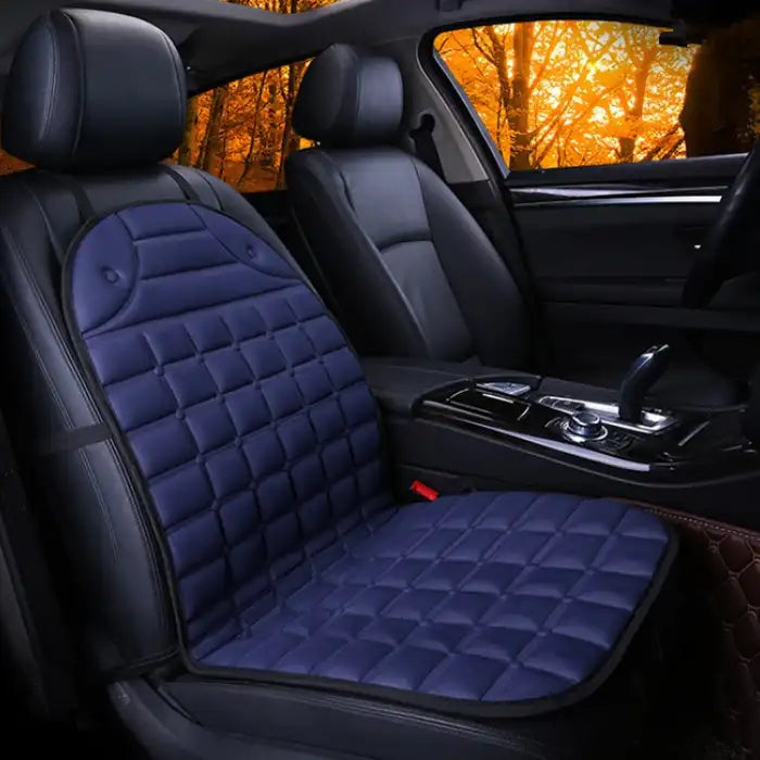 Car Seat Heater blue quilted cushion on single front car seat with dark interior.