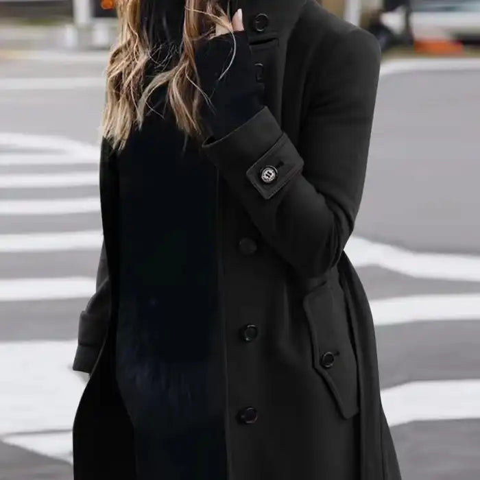 .Cardigan Large Coat in classic black with buttons, worn on street with subtle waves and sunglasses.