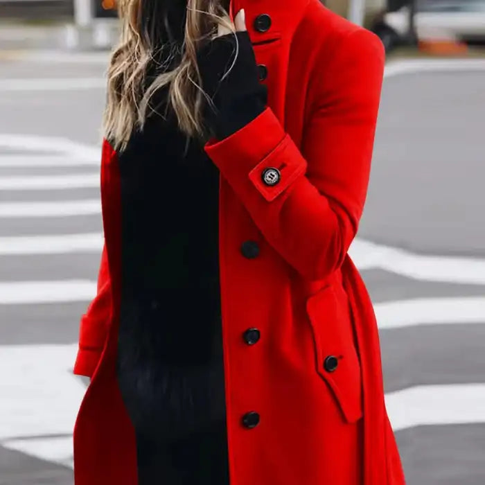 .Cardigan Large Coat in bold red, styled with black base outfit, ideal for standout winter street fashion.