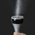 Cavitation Body Massager spray head in use emitting fine mist during skincare or slimming treatment