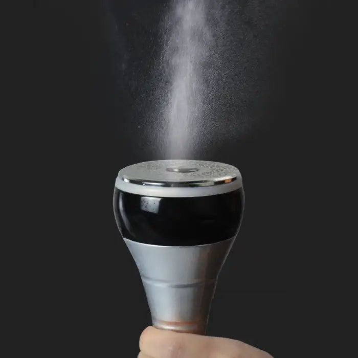 Cavitation Body Massager spray head in use emitting fine mist during skincare or slimming treatment