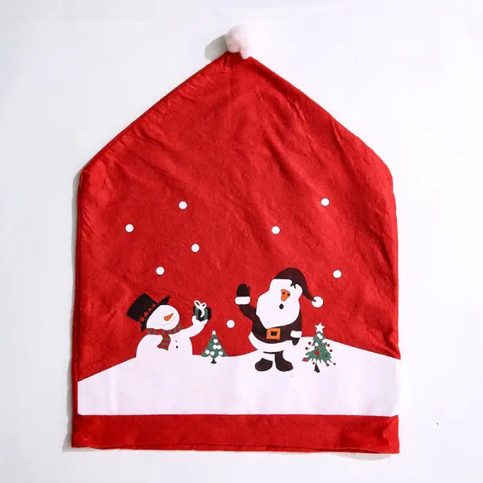 Santa hat shaped chair cover with snowman and Santa print in red and white on a flat surface.