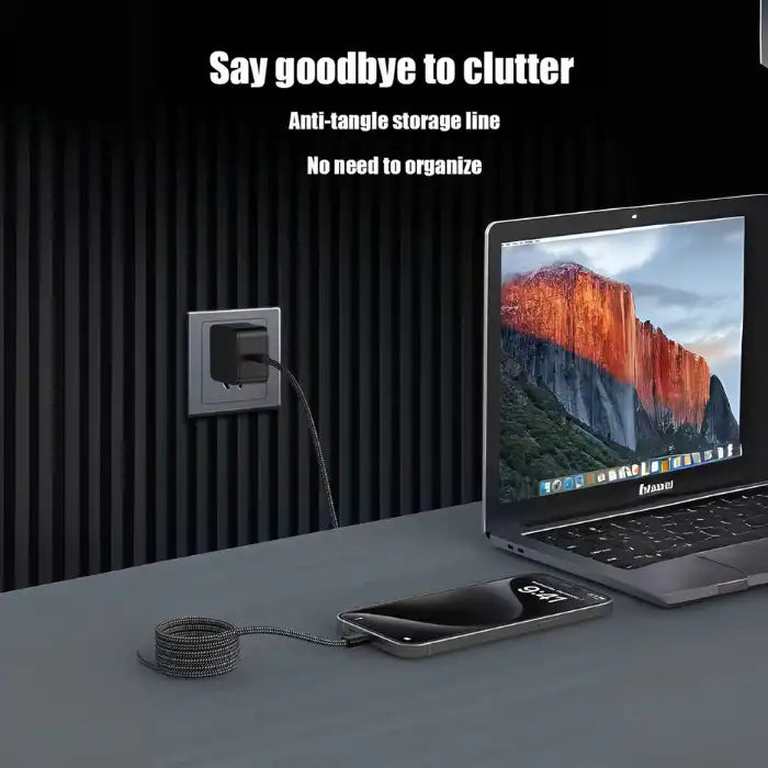 Charging cable with self-organizing coil design eliminating clutter, shown connected to laptop and smartphone in modern workspace