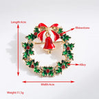 Christmas brooch with red bell and wreath shown with size, weight, and material specifications