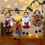 christmas decorations elderly plush snowman reindeer santa and bear ornaments hanging on branch with warm lights
