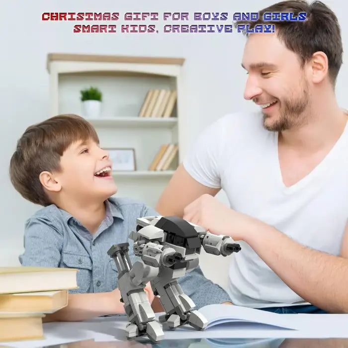 Father and son laughing while building a gray robot STEM kit, labeled as a Christmas gift for creative play.