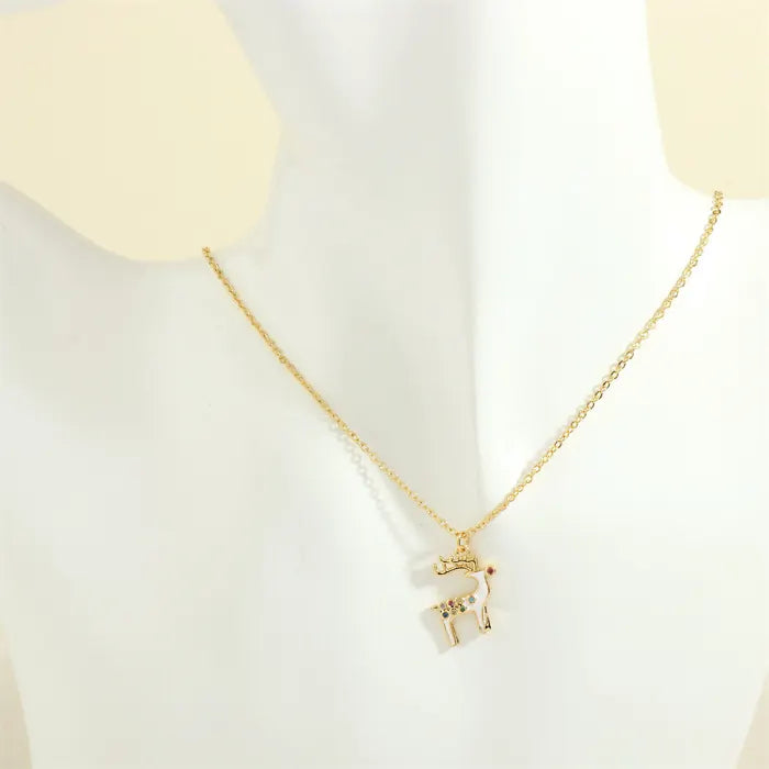 christmas jewelry gold necklace featuring enamel reindeer charm