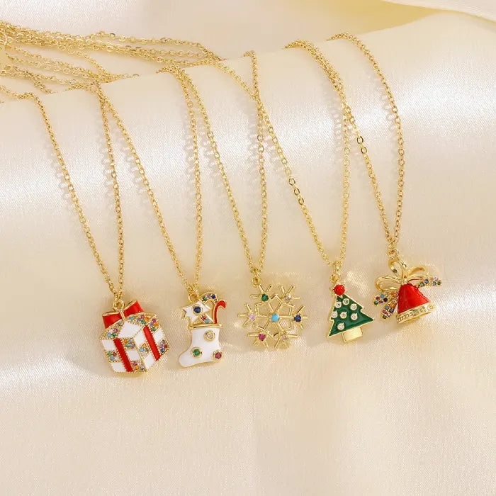 christmas jewelry set of gold necklaces with assorted festive charm pendants
