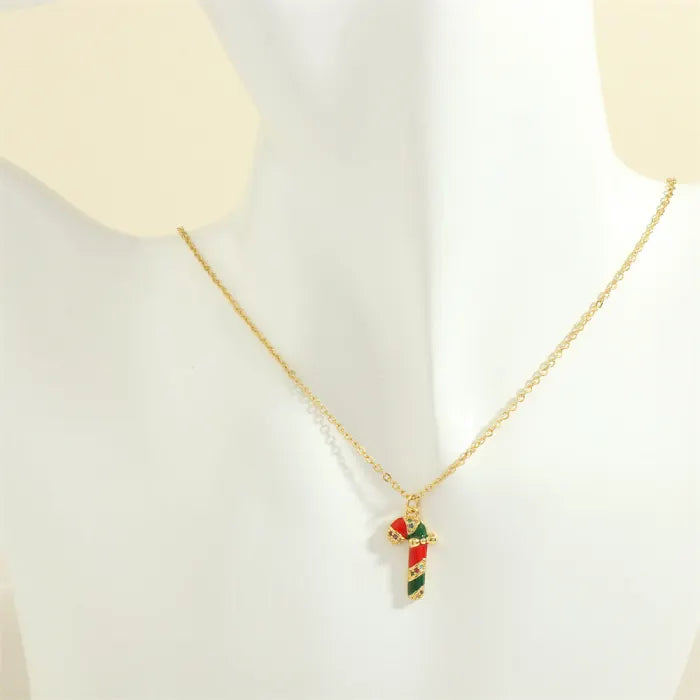 christmas jewelry gold necklace with red and green striped cross charm