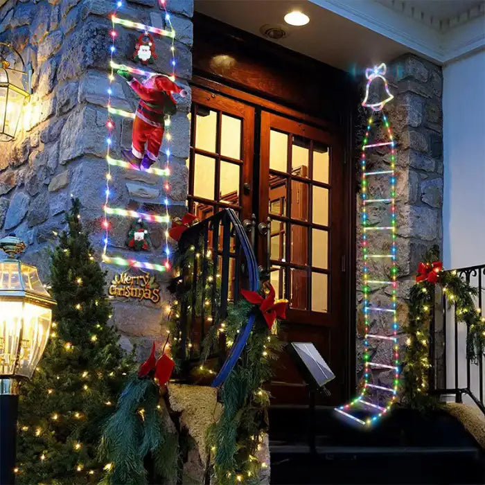 Christmas ladder lights with Santa climbing near stone porch decorated with garland and bows.