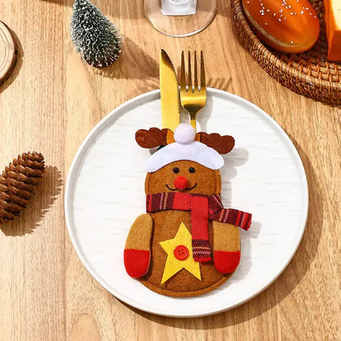 christmas table decorations showing a felt reindeer cutlery pocket with gold utensils
