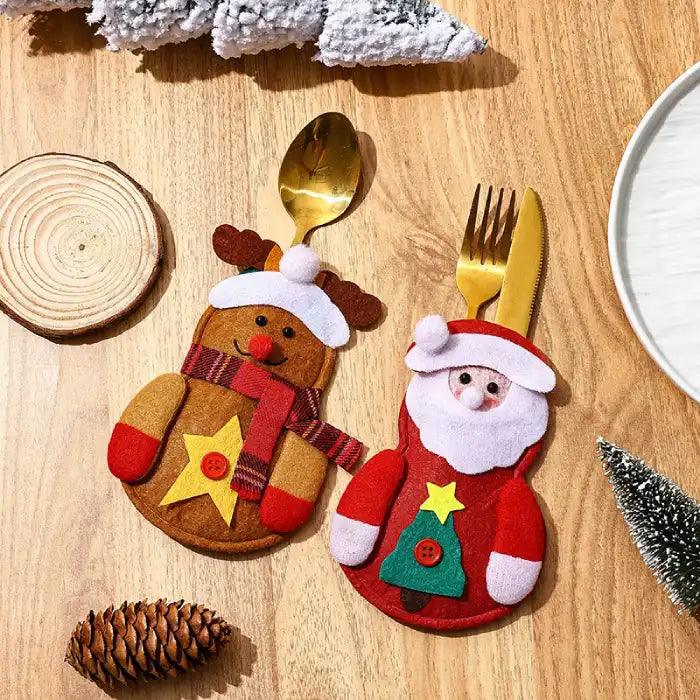 christmas table decorations featuring felt reindeer and santa cutlery holders with gold utensils