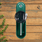 Cigarette Rolling Machine top view on wooden background showing the funnel and internal parts.