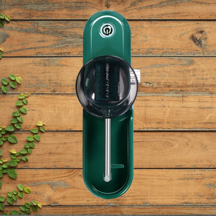 Cigarette Rolling Machine top view on wooden background showing the funnel and internal parts.
