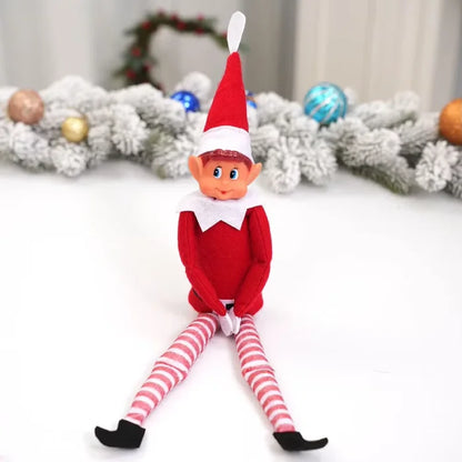 Traditional red elf sitting against frosted garland with colorful Christmas ornaments