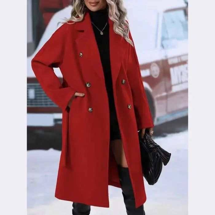 Bright red wool coat with double-breasted buttons, paired with black turtleneck and leather accessories in winter setting
