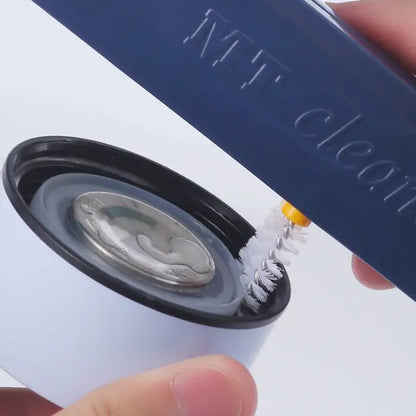  Close-up of cleaning brush bristles scrubbing a metal lid surface