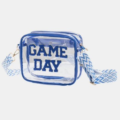 Stadium-approved clear crossbody bag with blue Game Day lettering and decorative chevron strap for sports events