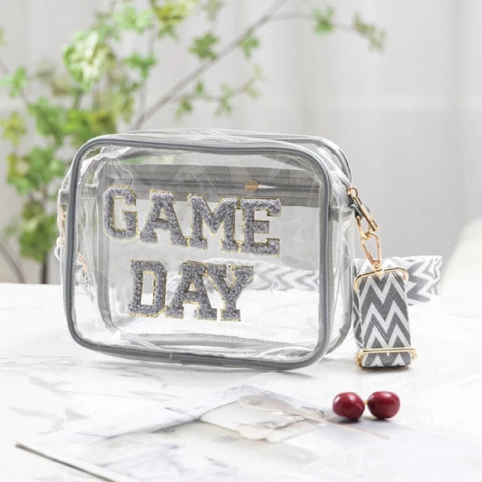 Stylish clear stadium crossbody bag with silver glitter Game Day text photographed with greenery and marble background