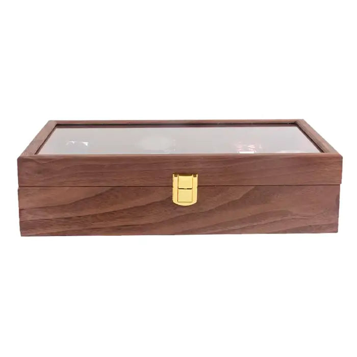 Closed wooden watch case with a gold latch and a smooth wooden exterior