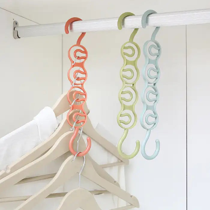 Closet organizer hanger displaying clothes on coral green and blue chain hooks