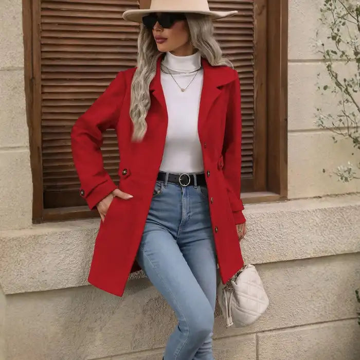 Coat Buttons red buttoned overcoat styled with jeans and white turtleneck.