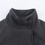 Collar Belt Overcoat high-neck close-up with two front buttons in charcoal wool for added warmth and style.