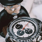 close-up of the collector watch display showing the gentleman figurine and the detailed watch face.