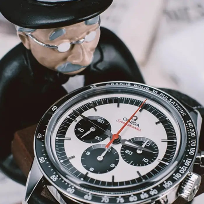 close-up of the collector watch display showing the gentleman figurine and the detailed watch face.