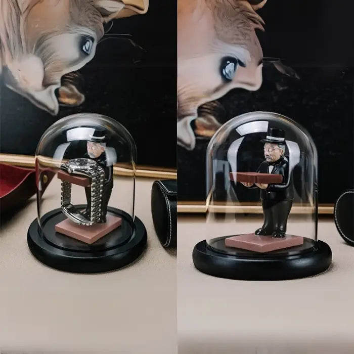 collector watch display figurine enclosed in a glass dome, showcasing a luxury watch on a black base.