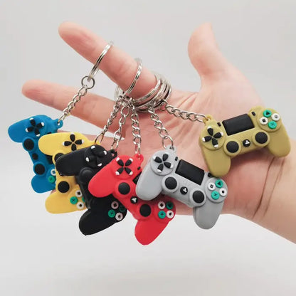 A variety of colorful game controller keychains displayed in hand, ideal for gaming-themed accessories.