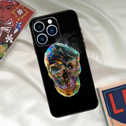 Colorful holographic skull phone case with vibrant, glowing hues on a sleek black background design.