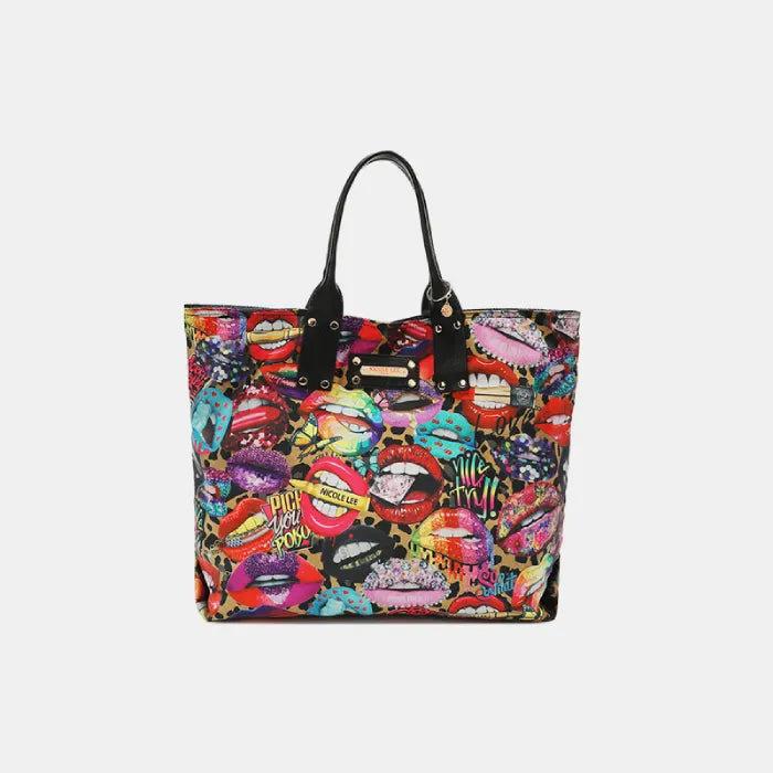 Large tote bag with vibrant multicolored lip print design, black handles, and gold hardware