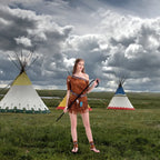 Complete one shoulder fringe costume set styled with staff, tassel belt, and sandals.