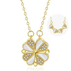 Convertible Heart Necklace close-up showing gold clover pendant with white enamel hearts