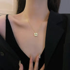 Convertible Heart Necklace worn on model featuring gold clover heart pendant