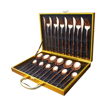 Elegant copper-plated cutlery set featuring knives, forks and spoons in luxurious presentation case