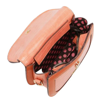 Open coral leather bag showing black and pink polka dot lining with multiple compartments and zippered pocket