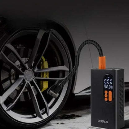 Black portable air compressor with digital display next to car wheel, highlighting 150PSI capability