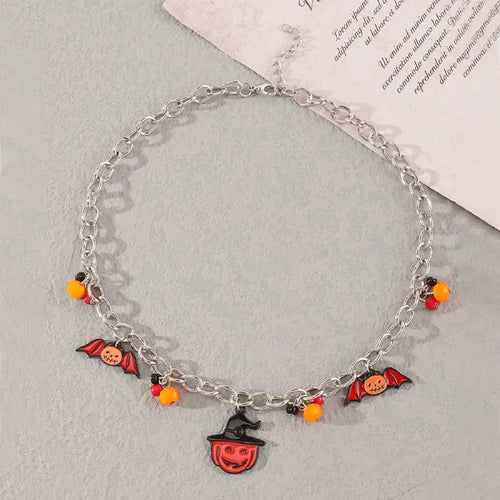 Front view of Halloween costume jewelry necklace with festive bat and pumpkin charms.