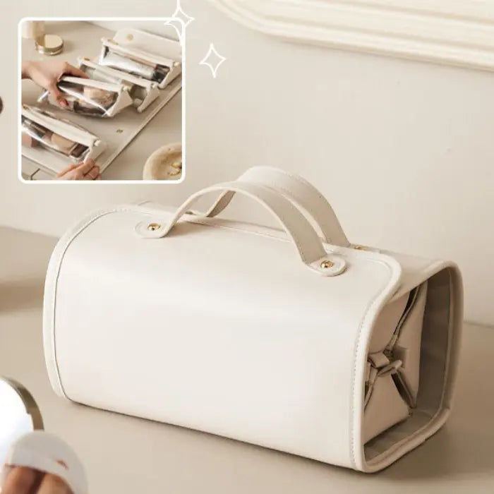 Cream-colored makeup bag with handle showcasing compact design for organized travel storage.