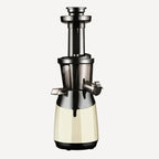 Premium slow masticating juicer in cream color showing detailed construction and extraction system design