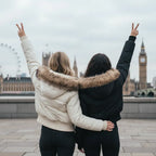 Cropped bomber jacket with fur hood from behind, winter-ready puffer jacket showing cozy insulation and relaxed fit