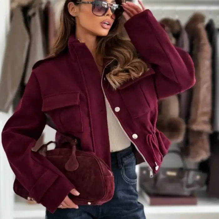 cropped wool jacket in burgundy with flap pockets and snaps, styled with jeans and matching suede handbag in closet bay.