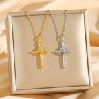 Cross Heart Necklace Set featuring gold and silver crystal cross pendants with intertwined heart design displayed on elegant jewelry box